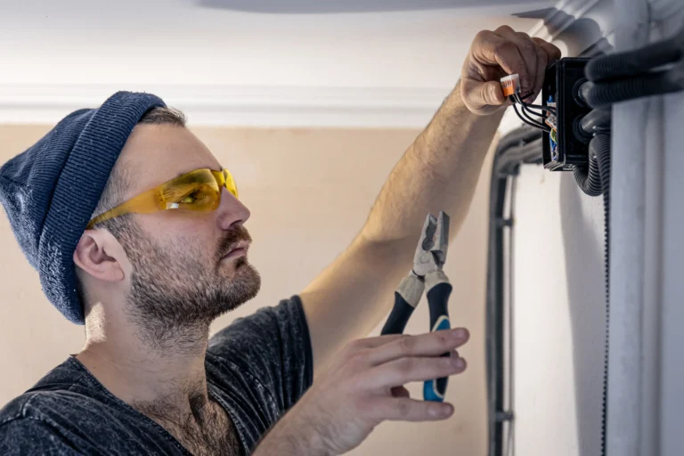 electrician-is-mounting-electric-sockets-white-wall-indoors